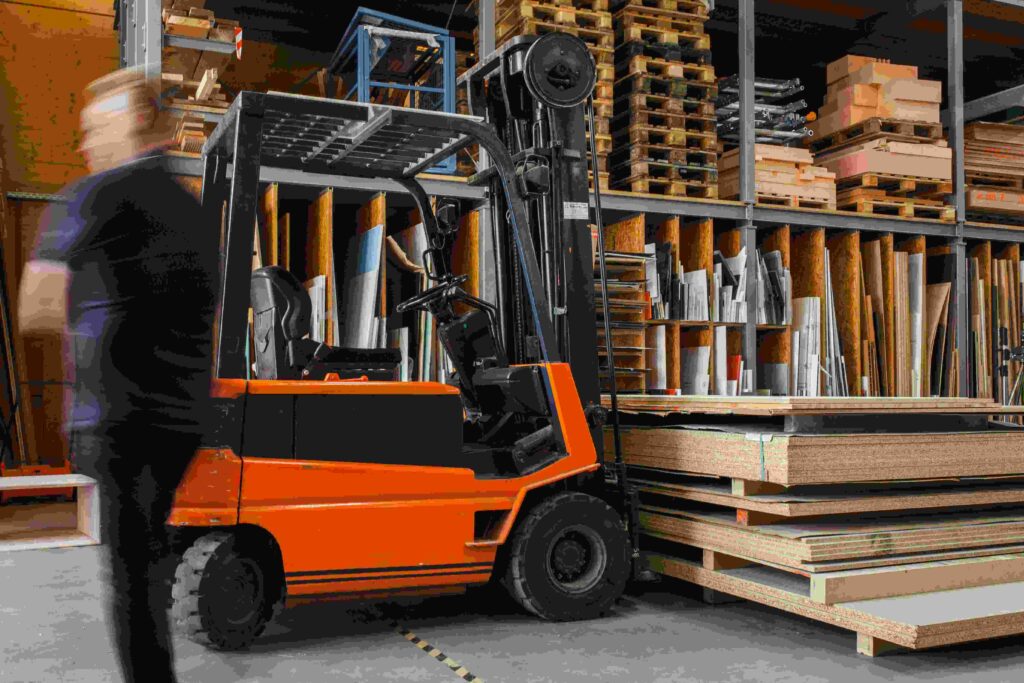 Image of a warehouse with forklift and palettes